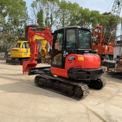Excavadora Kubota KX165-5 usada em bom estado, original japonês, peso operacional de 6 toneladas.